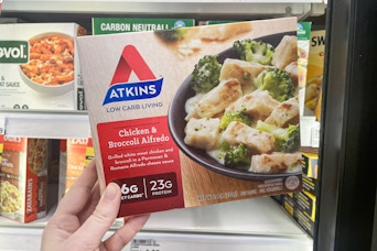 hand holding atkins frozen entree at meijer