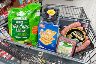 chips, blackberries, graham crackers, ground beef, and italian sausage in a cart
