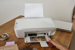 Woman using the HP DeskJet 2827e Wireless All-in-One Color Inkjet Printer.