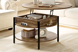 Lifestyle image of a round lift top coffee table in living room setting
