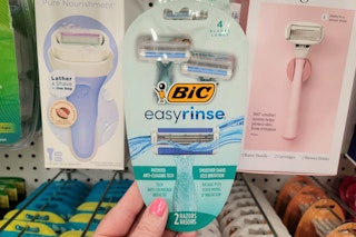 hand holding a pack of bic easy rinse razors