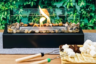 Lifestyle image of the Korniful Smores Maker Kit set up in an outdoor setting