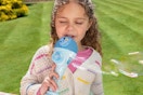 a girl singing into a bluey microphone