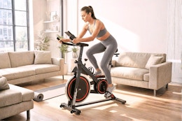 Lifestyle image of a woman on an exercise in her living room