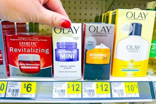 hand grabbing an olay moisturizer
