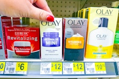hand grabbing an olay moisturizer