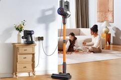 Zynet S8 Cordless Vacuum Cleaner parked next to a console.