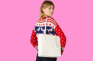 a woman with a white kate spade tote