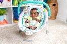Lifestyle image of the Bright Start Jungle Baby Bouncer (on carpeted floor in room setting)
