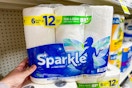 hand touching a pack of sparkle paper towels