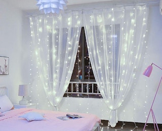 string lights on curtains in a room