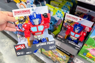 hand holding bop it transformers game in walmart toy aisle
