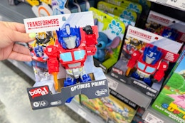 hand holding bop it transformers game in walmart toy aisle