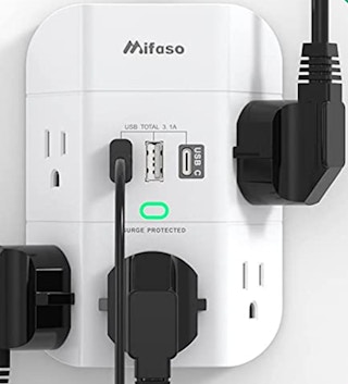 A wall surge outlet with plugs on the wall