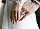 Two couples showing off their wedding rings