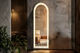 Lifestyle image of the EDX LED full length arched mirror in a home setting