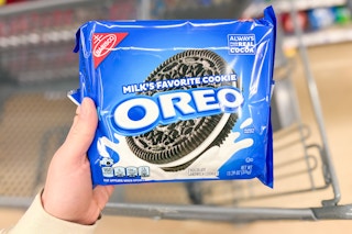 hand holding a pack of oreo cookies