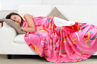 a throw blanket on a couch