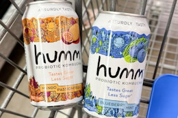two cans of kombucha in a Walmart cart