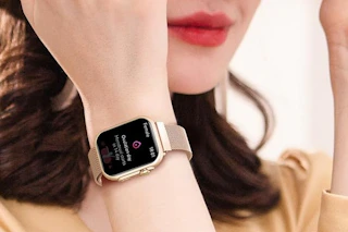 a woman wearing a smartwatch