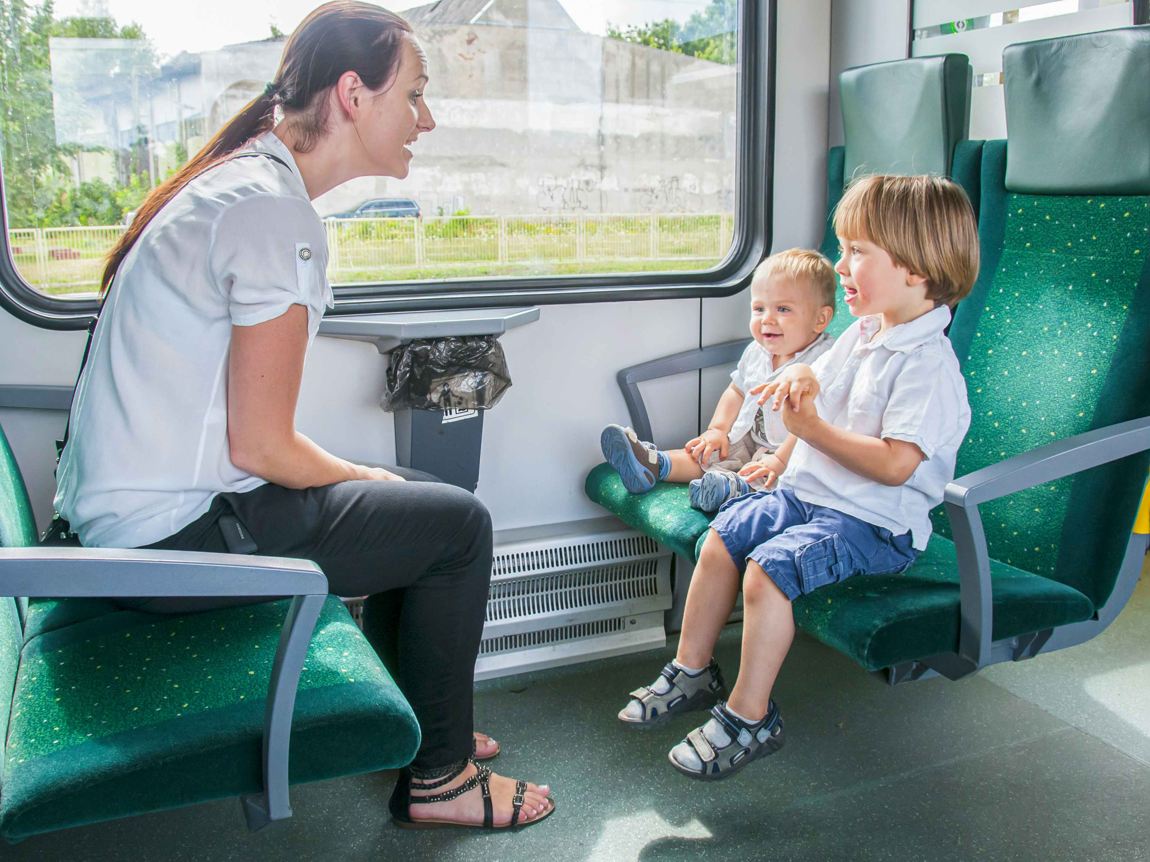 a mother and her children on a train