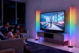 floor lamp beside entertainment center in living room