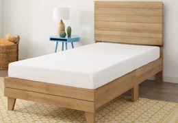 room essentials gel memory foam mattress sitting on a bed