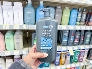 hand holding dove men's body wash at walgreens