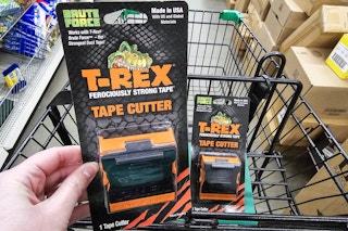 person holding a trex tape cutter over a cart