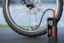 a tire inflator next to a bike