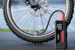 a tire inflator next to a bike