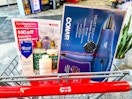 cvs cart with crest gum toothpaste, sheadmoisture and olaplex shampoo, and a conair hair dryer in it with a cvs epic beauty flyer
