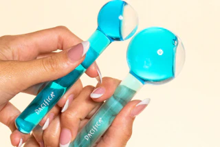 a woman holding pacifica globes