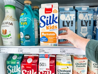 hand grabbing silk kids' oatmilk blend off a target shelf
