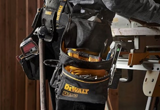 person wearing the DeWalt carpenters tool belt