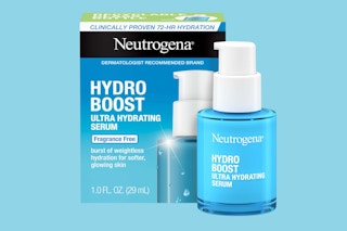 a blue bottle of face serum next to a box