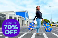 model walking across the parking lot walk way outside of Walmart