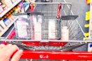 person pushing a cart with olaplex haircare in it