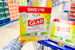 hand holding a box of glad trash bags