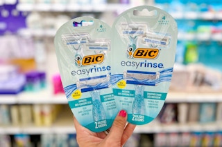 Two Bic EasyRinse Razor 2-packs held up in front of personal care items in stores at Target