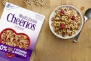 bowl of cereal on table next to the box