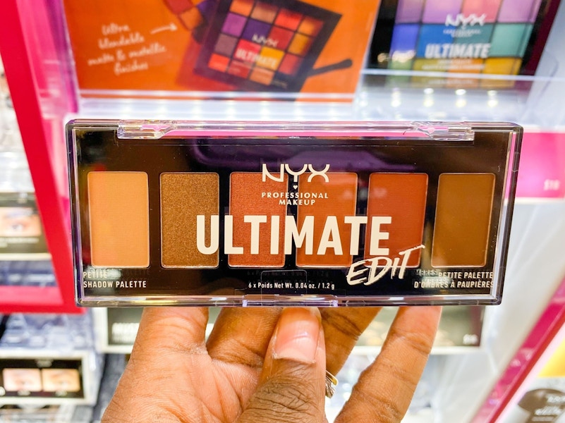 A person's hand holding NYX ultimate edit eyeshadow palette in Ulta.