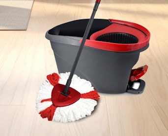 a mop with a tank bucket on hardwood floors