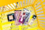 maybelline cosmetics in yellow shopping basket