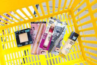 maybelline cosmetics in yellow shopping basket