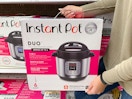 person holding Instant Pot Duo product at Target