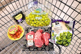 blackberries, grape tomatoes, grapes, broccoli, and steaks in a cart