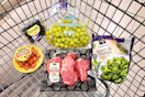 blackberries, grape tomatoes, grapes, broccoli, and steaks in a cart
