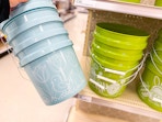 hand holding an easter bucket in front of a target shelf