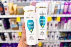 hand holding two pantene shampoos